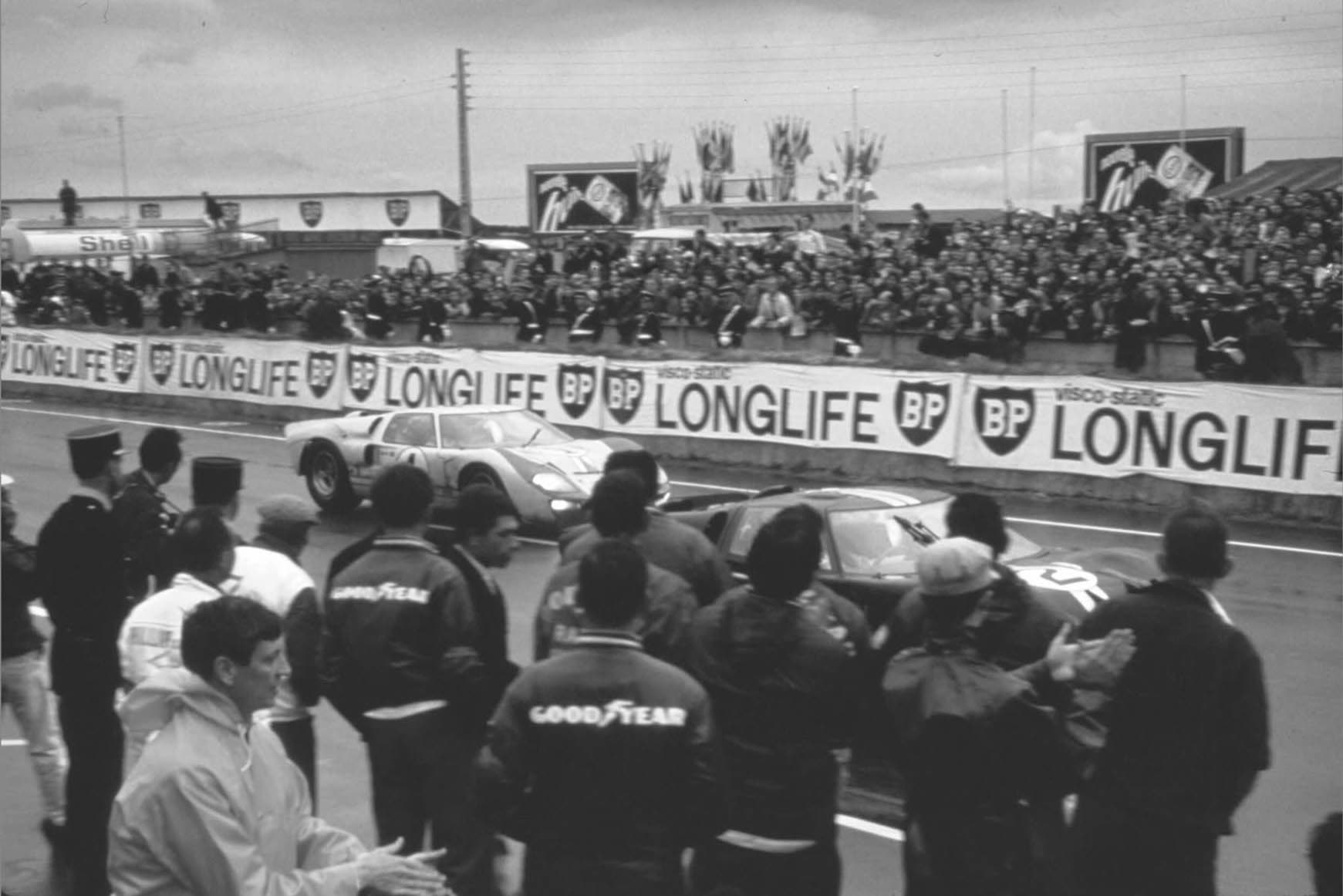 Ford GT40s passing the pits at the 1966 24 Hours of Le Mans